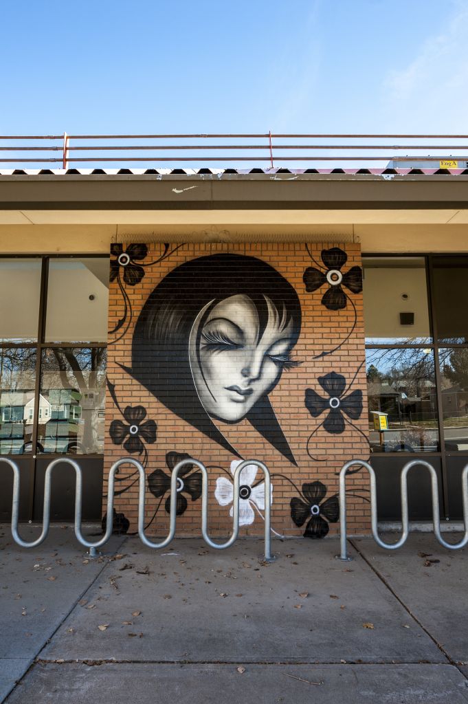 Go to the Untitled (image of women's face with flowers around her) page