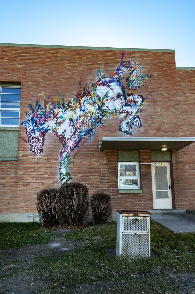 Go to the Untitled (a white horse jumping down from overhang) page